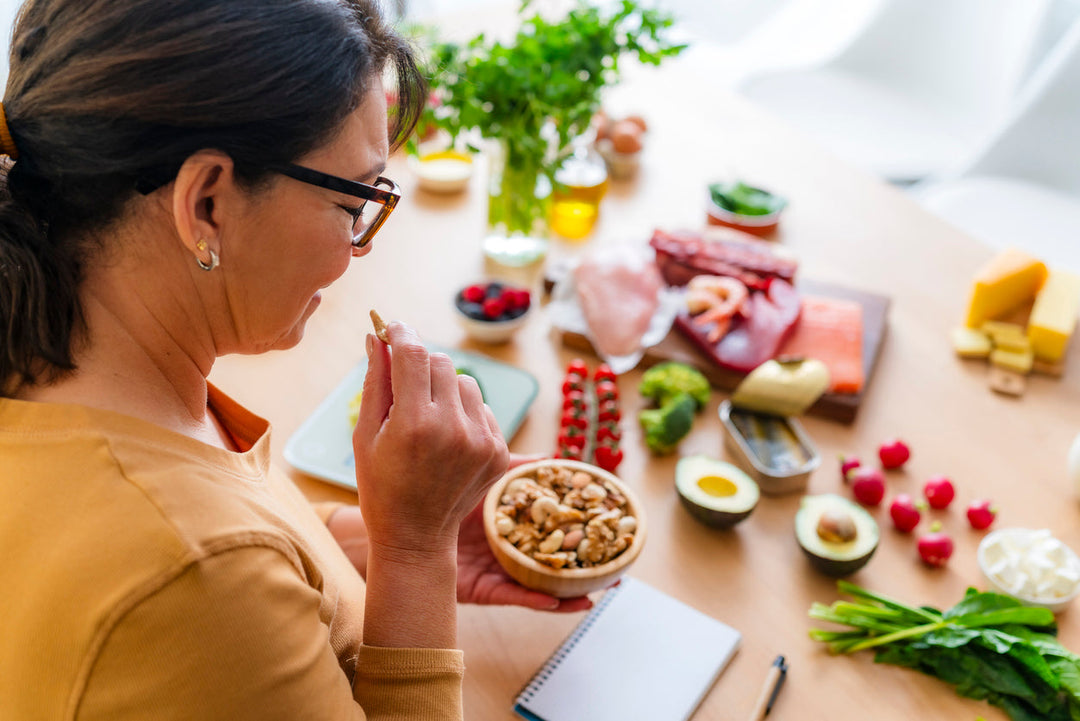 Healthy eating and dieting: woman planning a healthy low carb diet