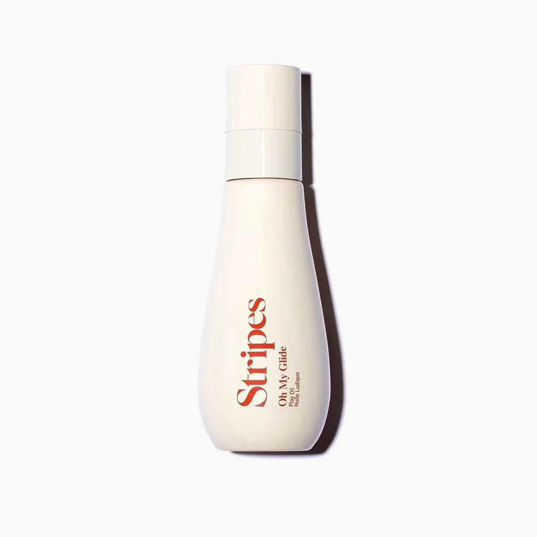 White bottle of Stripes Oh My Glide oil-based moisturizer with Squalane and coconut oils for sensitive skin.