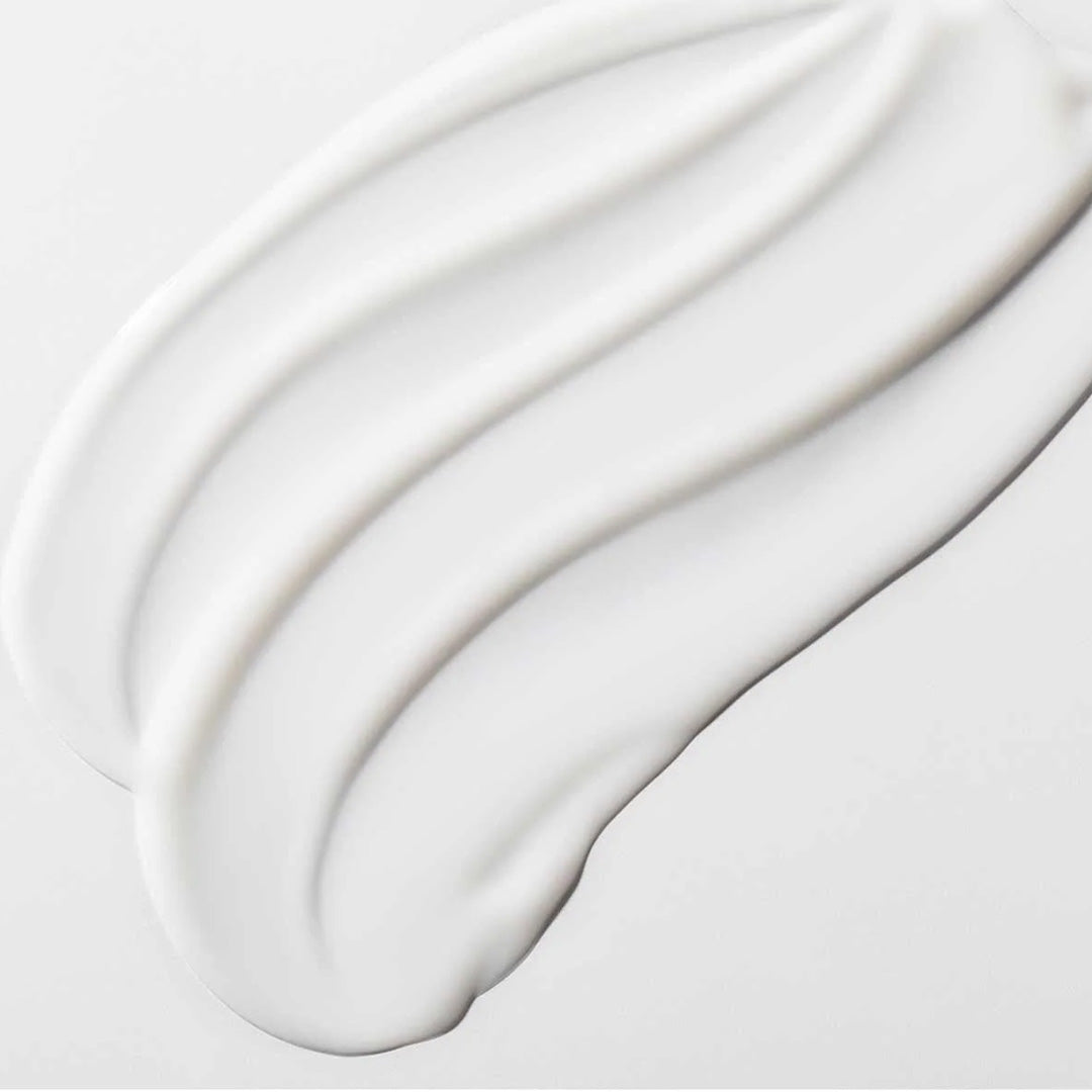 Creamy white serum texture spread smoothly representing The Power Move hydrating skincare product.