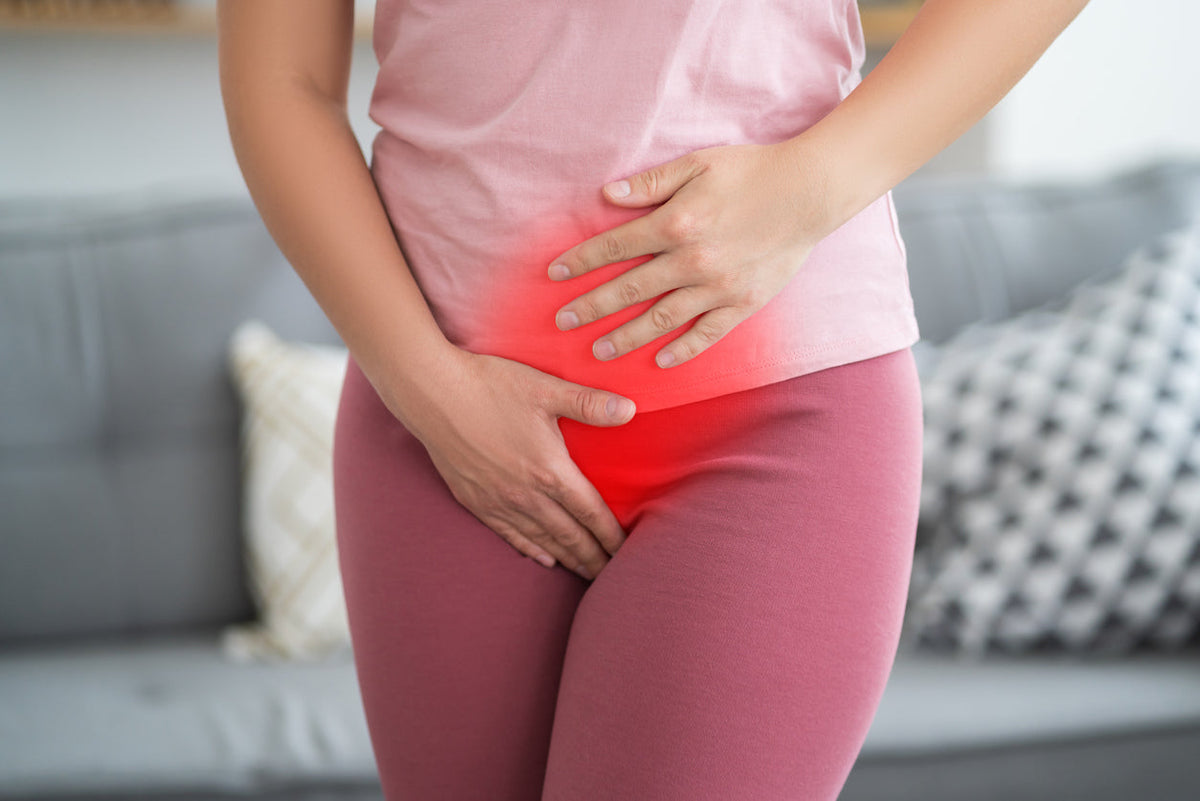 Women holding a pelvis because of menopause pain during intercource