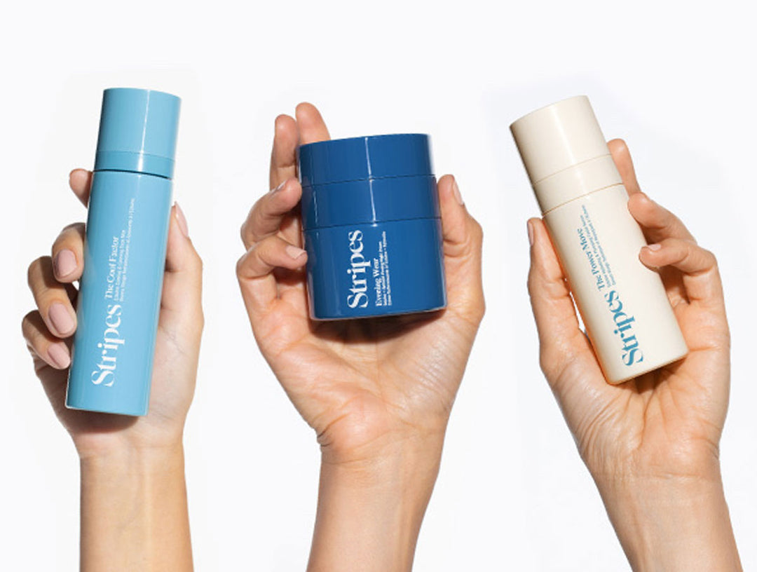 Hand holding The Cool Factor, The Evening Wear and the Power Move products