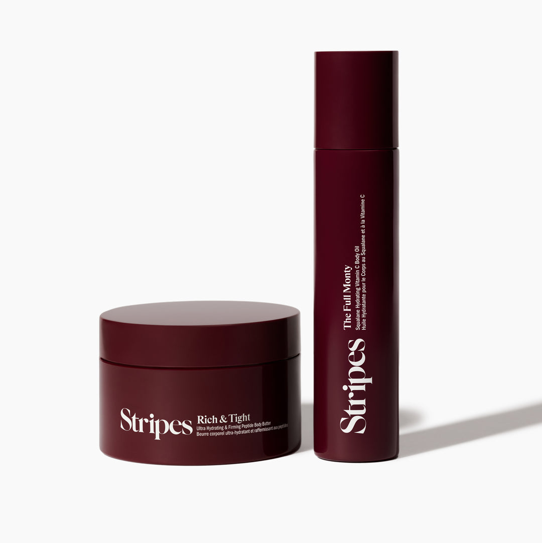 Two dark red Stripes Body Works skincare containers with clean design on white background