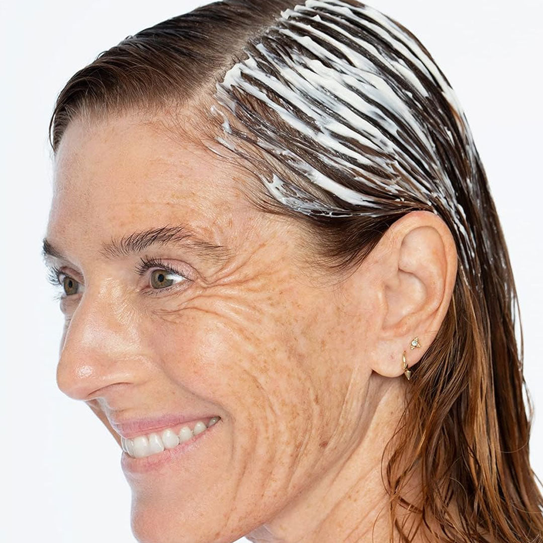 Female Model with hair mask on her long hair