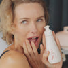 Naomi in a Hotel Bedroom showcasing Oh My Glide Play oil Product.
