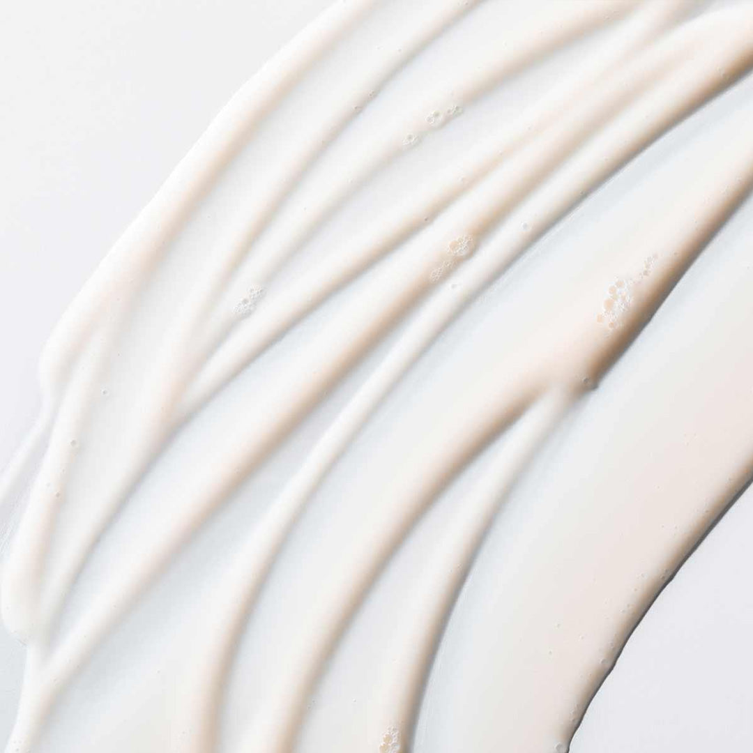 Close-up of creamy texture of Resting Clean Face cleanser highlighting smooth hydration and gentle skin soothing properties.