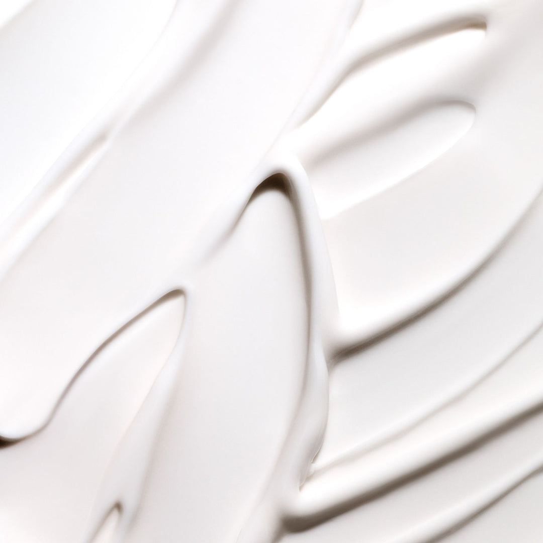 an image showing the creamy texture of of Rich & Tight firming body butter 
