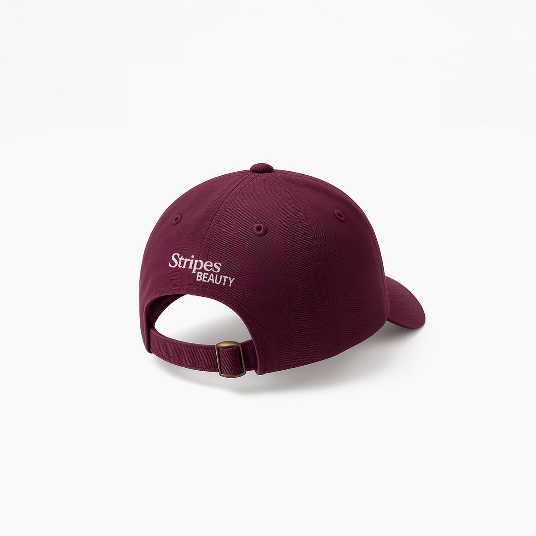Maroon cap with 'Stripes Beauty' logo on a white background