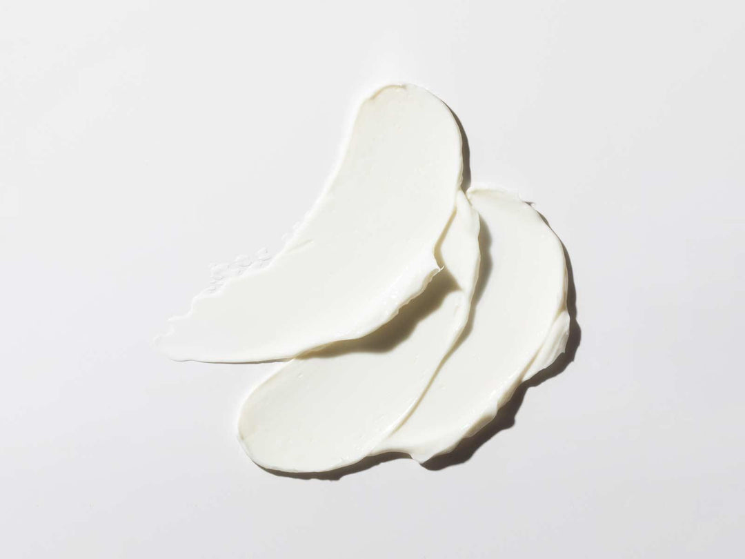 Evening Wear firming night cream texture with ectoine and retinoid for hydration, elasticity, and reducing fine lines.